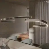 Distinguished Cattelan Italia Bluebell suspension lamp with intersecting arcs in dark metal and golden brass accents