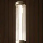 Cylindrical wall light, ribbed borosilicate glass, brass caps, vertical wood paneling, bright white illumination, textured contrast.