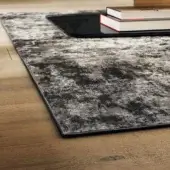 Superior Lago Dive rug crafted with durable technical materials in blended dark and light gray tones presenting a textured surface