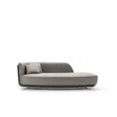 Sophisticated OAK Solomon chaise lounge with enveloping shapes upholstered in textured matte medium gray textile and sleek dark gray frame