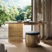 Distinguished Reflex Monolite desk with bronze Marmoreflex/Legnoreflex top and smoked-grey glass leg, supported by latticed London engravings and stool