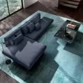 Superior Lago Air sectional with deep blue textile, matte finish and extra-clear tempered glass legs