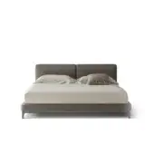 Distinguished OAK Tribeca bed with low profile design and matte medium gray textile upholstery resting on a black chrome painted wooden base