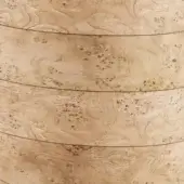 Pluff side table, beige wood grain, circular top with layered texture and mottled brown markings, rustic appearance.