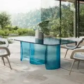 Elegant Reflex Petalo Acqua table with curved bases and textured Acqua glass top crafted in Italy