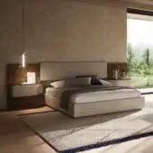 Exceptional Reflex Wave XL bed with light beige upholstery and polished steel details crafted in Italy