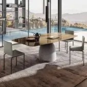Distinguished Lago Janeiro table with brownish glass top and natural anthracite textured concrete base