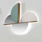 Wall lamp, brass and sage green, circular design with layered fan elements and rectangular frame, studio lighting.
