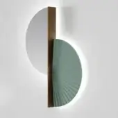 Wall lamp, sage green fluted shade, bronze metal frame, circular mirror, silvered glass, minimalist geometric design, light gray wall mounting.