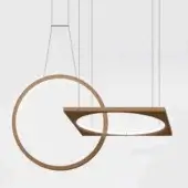 Drop suspension lamp, bronze metal, intersecting circular and rectangular forms suspended by white cords, studio lighting, gray background.