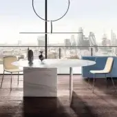 Innovative Lago Stratum table with round XGlass top mimicking marble swirls and stratified glass leg allowing light filtration