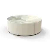 Ikat coffee table, beige fabric base, silver band, round glass tabletop with white, cream, gray-green abstract textile pattern.