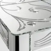 Mirrored console table, reflective glass and mirror, rectangular shape with engraved floral patterns and green-tinted interior detailing.