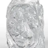 Abstract human bust sculpture, clear resin with swirling internal patterns, organic form against a light gray backdrop.