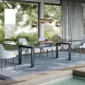 Elegant Reflex Policleto table, a contemporary table with transparent tempered glass and glossy dark gray metal legs