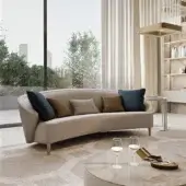 Elegant Bizzotto Italia Wave sofa upholstered in smooth light beige textile with lacquered metal legs and curated throw cushions