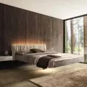 Innovative Lago Fluttua Replis bed with calming matte gray textile upholstery and vertically pleated headboard built with an HPL base