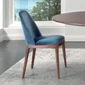 Refined Pacini & Cappellini Becky chair with enveloping shell and plush blue textile upholstery