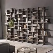 Distinguished Pacini & Cappellini bookcase crafted in Italy with wood, showcasing an asymmetrical geometric silhouette and matte medium-brown finish