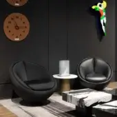 Distinctive WAYNE Enterprises WE-003L lounge chair with sleek black leather upholstery and glossy black metal swivel base