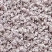 Dense composite texture in pale pink, beige, and off-white tones with granular, irregular particles and subtle color saturation variation.