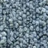 Granular texture sample in gray, charcoal, and pale green tones, displaying dense, uneven particle accumulation with faint text overlay.