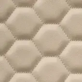 Quilted hexagon texture in light beige leather, featuring stitched borders and rounded centers arranged in a uniform grid pattern.