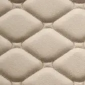 Beige leather texture with quilted elongated diamonds, fine tonal stitching, and a subtle pebbled grain; “formitalia” text at the bottom.