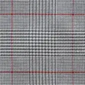 Prince of Wales check fabric, gray and navy with red outline, woven texture displaying intersecting squares and rectangles, studio lighting.