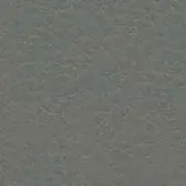 Dark gray textured surface displaying a repeating pattern of small, irregular shapes with a muted, matte finish and subtle shade variations.