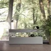 Innovative Lago Air sideboard with transparent tempered glass supporting matte grey blocks and XGlass textures