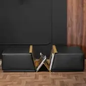 Distinguished Wayne Enterprises WE-158 ottoman with black leather cushions and gilded V-shaped metal rack crafted in Italy