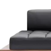 Modular sofa section, black quilted leather, square tufted seat with rectangular panels and dark wood base.