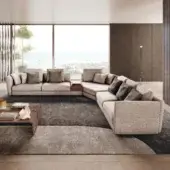 Sophisticated Pacini & Cappellini Ester sectional in light beige woven textile with a concealed base and integrated wooden side table