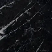 Marquinia marble texture displaying black and white veining, polished surface with irregular streaks, gray markings, and a dense, granular pattern.