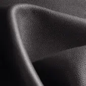 Black leather texture, folded swatch with pebble grain, displaying a curved edge and subtle tonal variations against a dark backdrop.