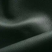 Dark green pebble-grain leather swatch with a diagonal fold, displaying a muted, deep tone and substantial texture with diffused lighting.