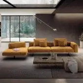 Lavish Lago Air Soft sectional with golden-yellow textile upholstery and sleek dark metal supports crafted in Italy