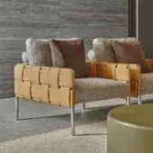 Elegant Turri Ratio lounge chair with woven leather structure and light dark brown flecked textile cushions with glossy metal legs