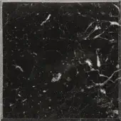 Nero Marquina marble sample with black background, gray and white speckles, polished surface, and white veins framed by a silver border.