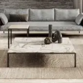 Elegant Turri Ratio coffee table with a patchwork marble top and thin dark metal structure