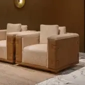 Distinctive Turri Atelier lounge chair with light beige fabric padding and medium brown leather-like accents built with horizontal straps