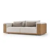 Lavish Turri Atelier sofa with light beige textile upholstery and smooth brown leather accents built with discreet legs