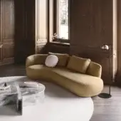 Lavish Nicoline Amalfi sofa crafted with a continuous seat and back in textured muted yellow-gold textile