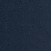 Navy blue granular texture, consistent tone, and diffused lighting showcase a tightly woven or embossed material surface in a studio setting.