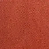 Reddish-orange woven fabric texture features a dense, repeating chevron geometric pattern; matte finish, structured weave for upholstery.