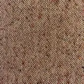 Herringbone fabric texture in brown, cream, orange, and black with a dense, nubby weave; label reads "moroso House of Lords A6941 brown".
