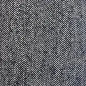 Herringbone fabric texture in charcoal gray and off-white, dense weave with chevron pattern; Moroso “House of Lords A6944–999 Black”.