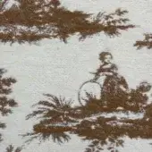 Toile de Jouy fabric swatch in rust and cream features repeating trees and a woman on horseback, with a woven texture and dense pattern.