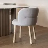 Distinguished Moroso Getlucky chair with light gray upholstery in a matte finish and solid varnished ash wood frame